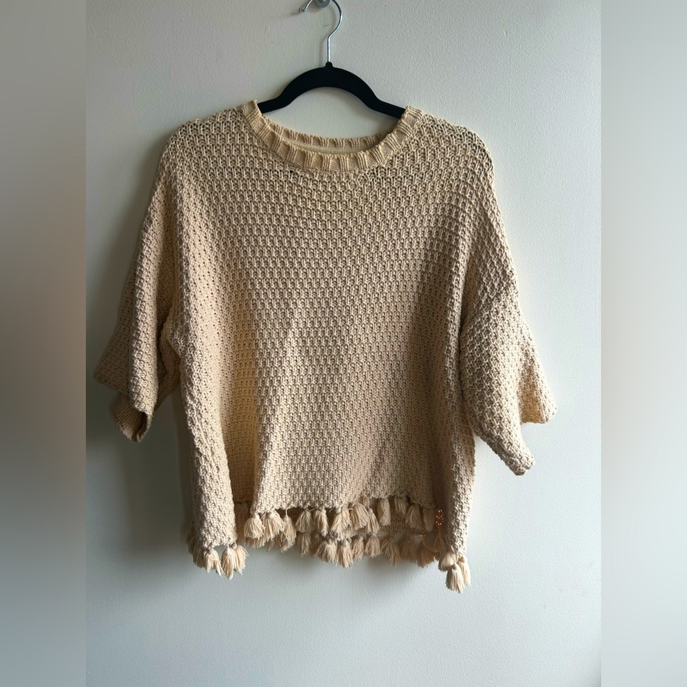 Cream Knit Sweater with Tassel Hem